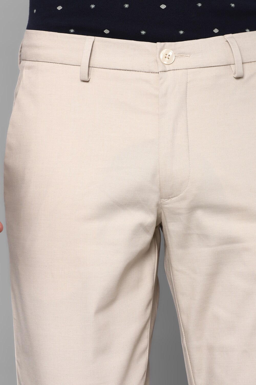 34146-men-cream-slim-fit-solid-flat-front-casual-trousers-cream-1.jpg