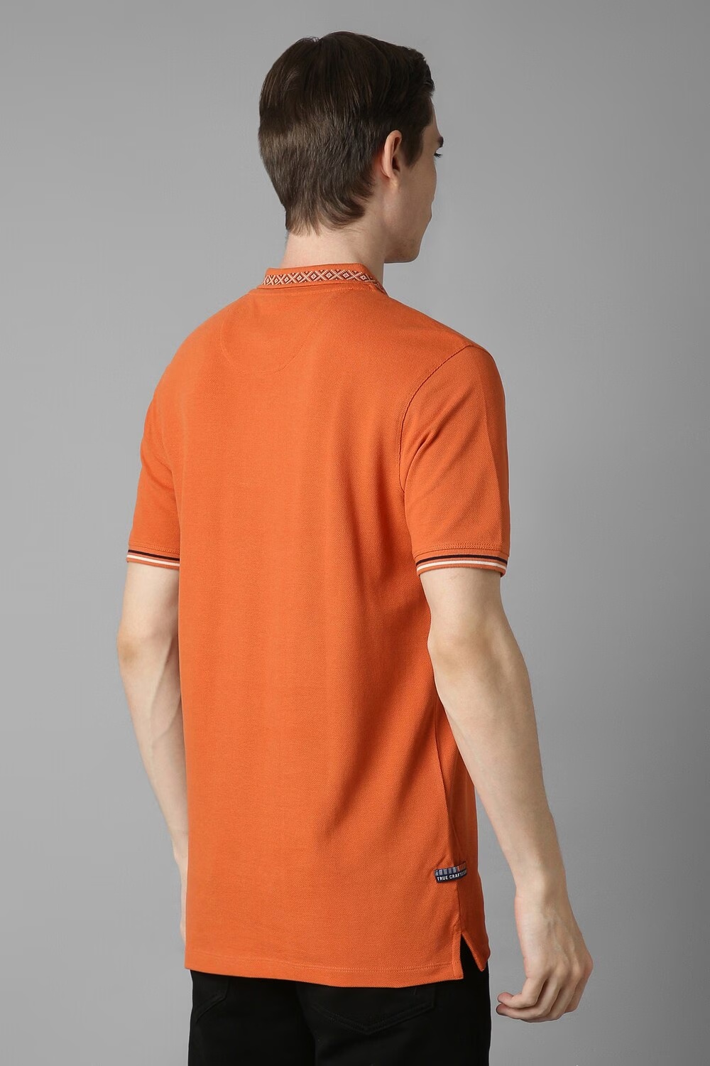 37672-men-orange-solid-polo-neck-t-shirt-orange-1.jpg