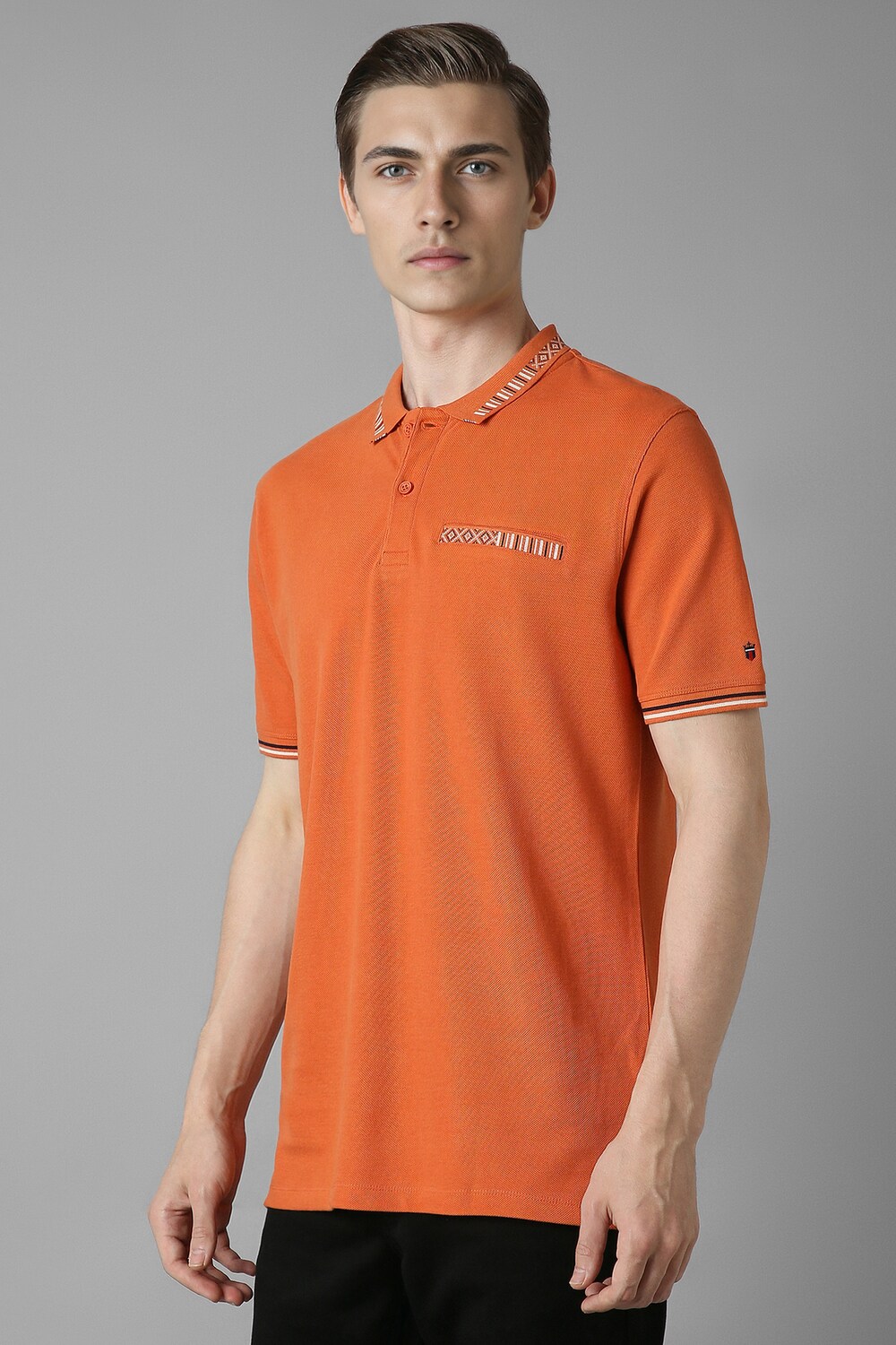 37672-men-orange-solid-polo-neck-t-shirt-orange-1.jpg