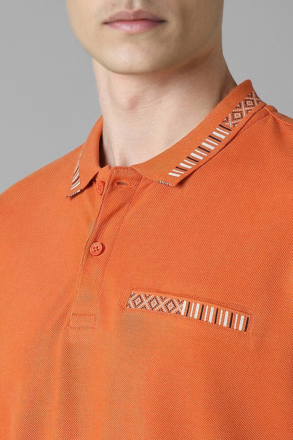 37672-men-orange-solid-polo-neck-t-shirt-orange-1.jpg