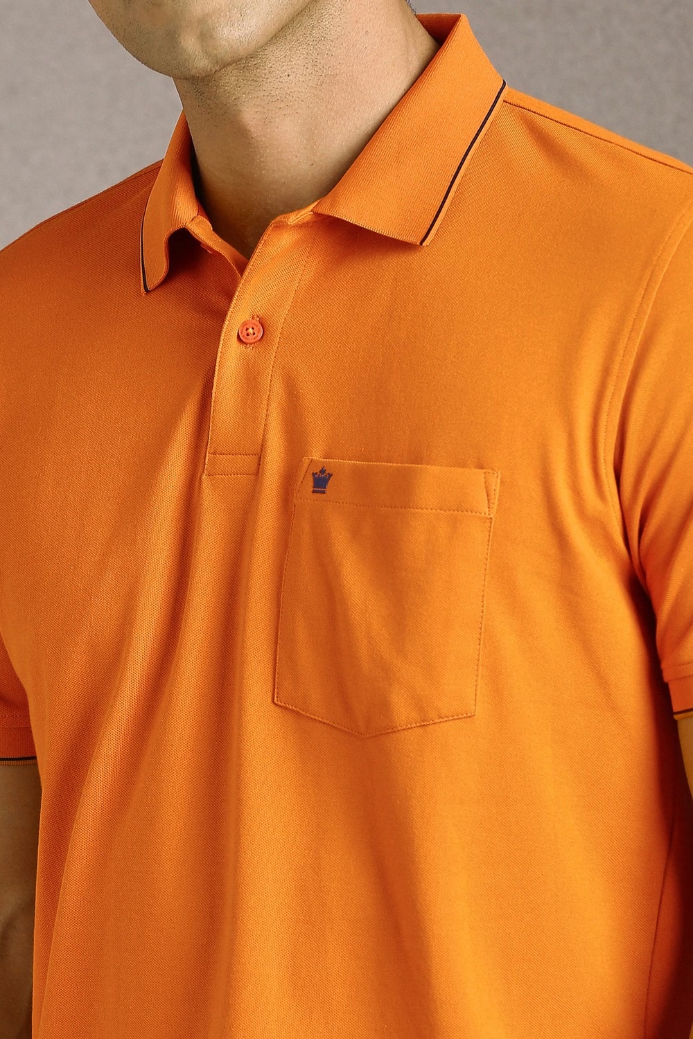 42996-men-orange-solid-polo-neck-t-shirt-orange-1.jpg