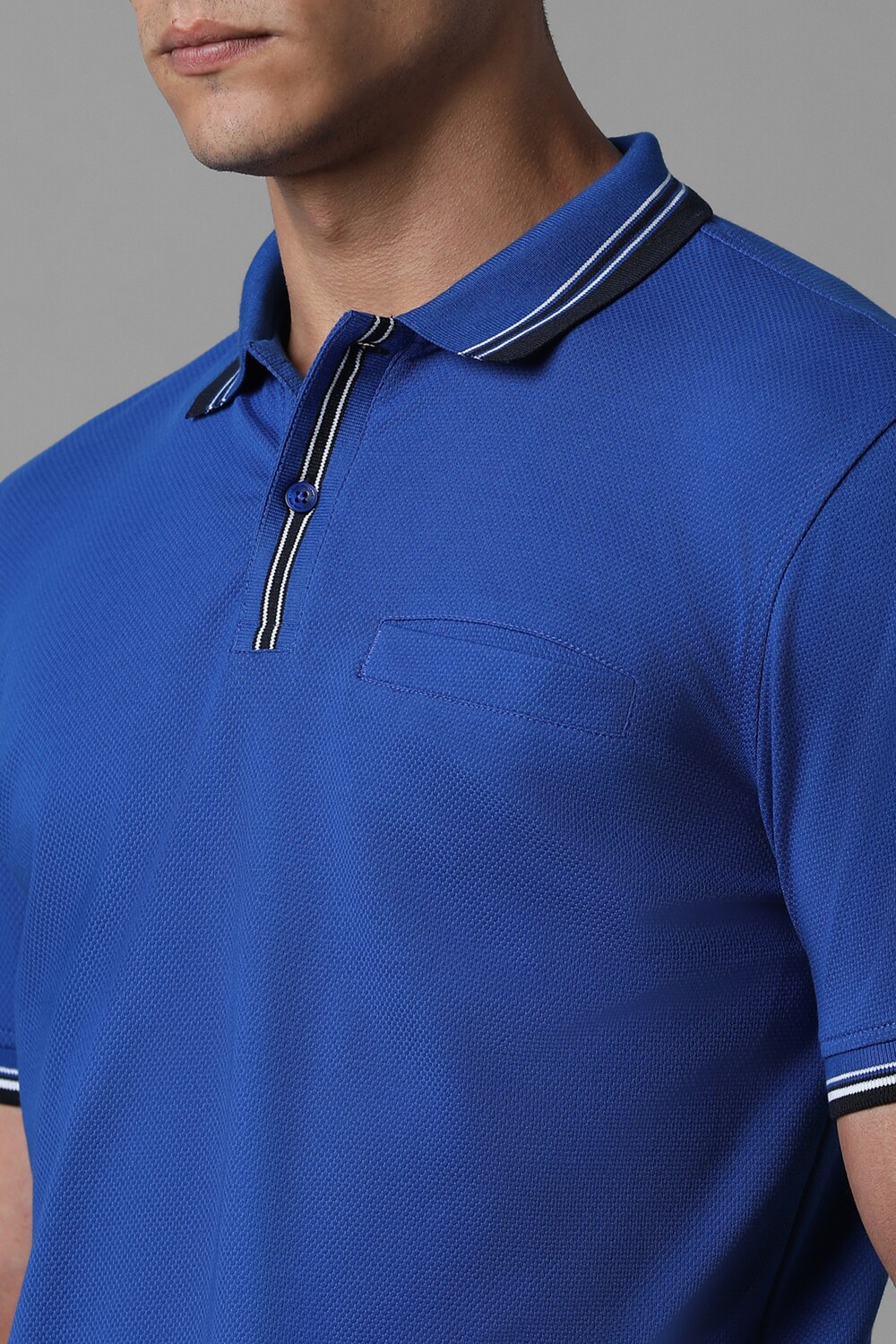62352-men-blue-solid-polo-neck-t-shirt-blue-1.jpg