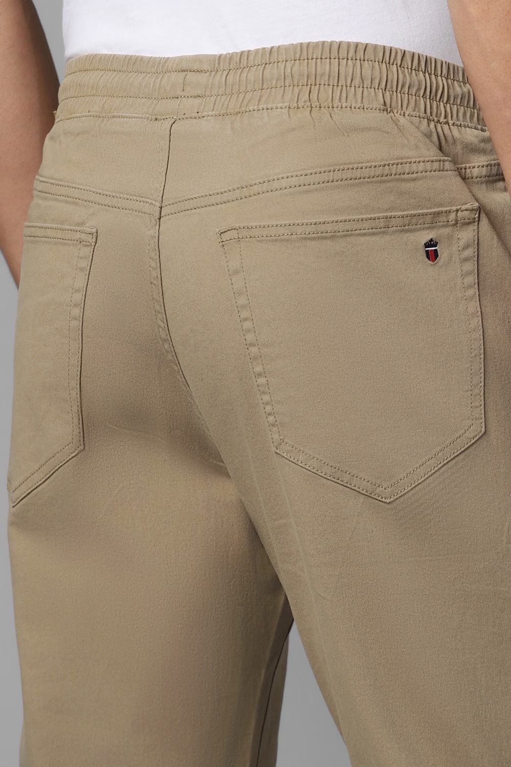 75063-men-khaki-solid-flat-front-casual-trousers-khaki-1.jpg